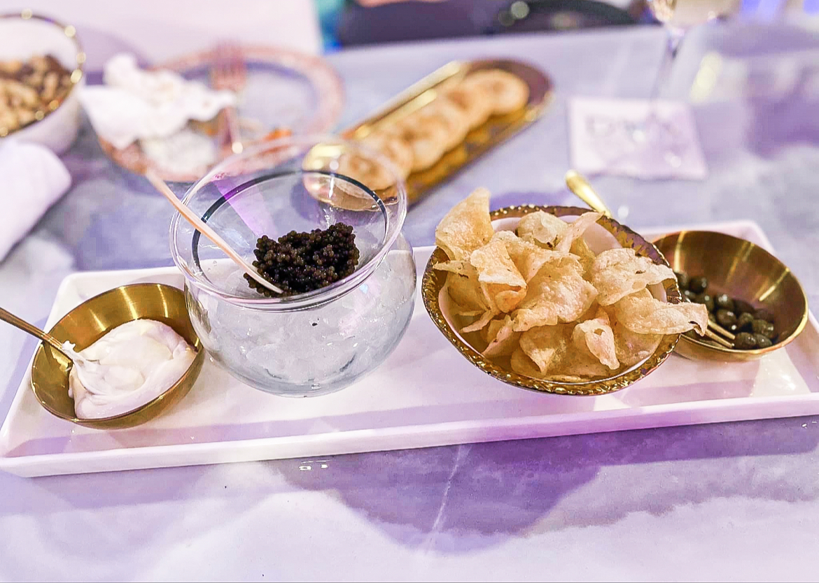 caviar board with chilled caviar, capers, sauce